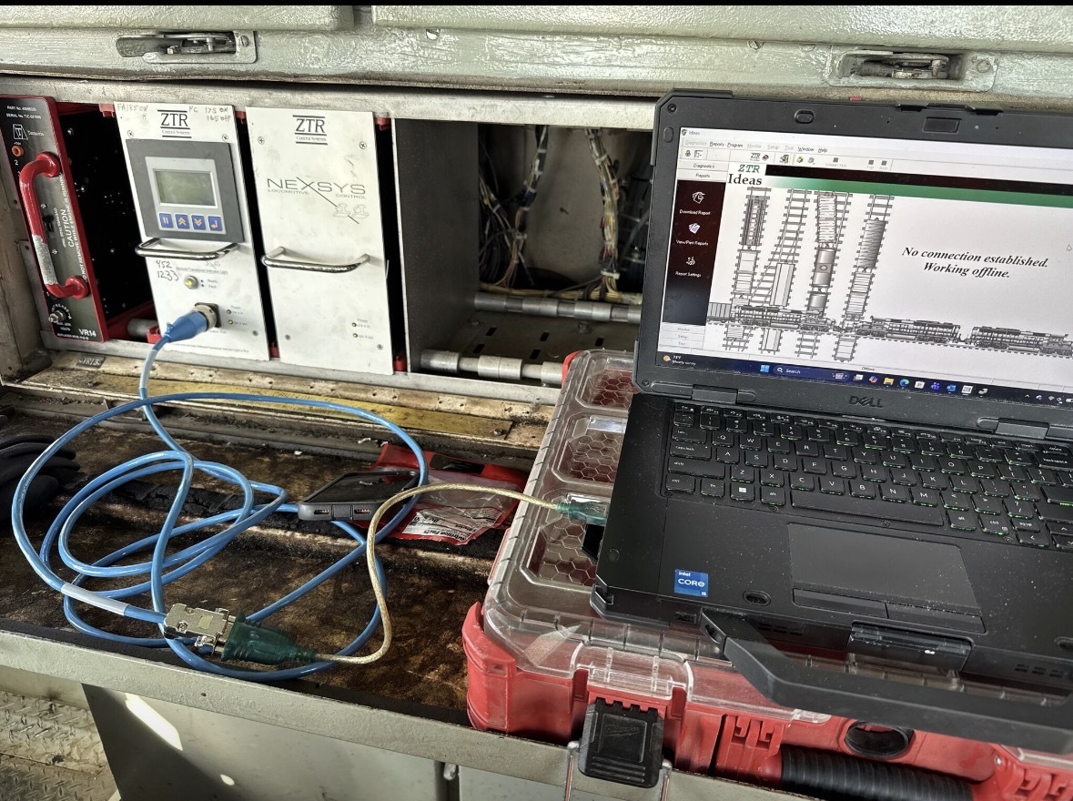 Field laptop connected to locomotive control equipment during diagnostics